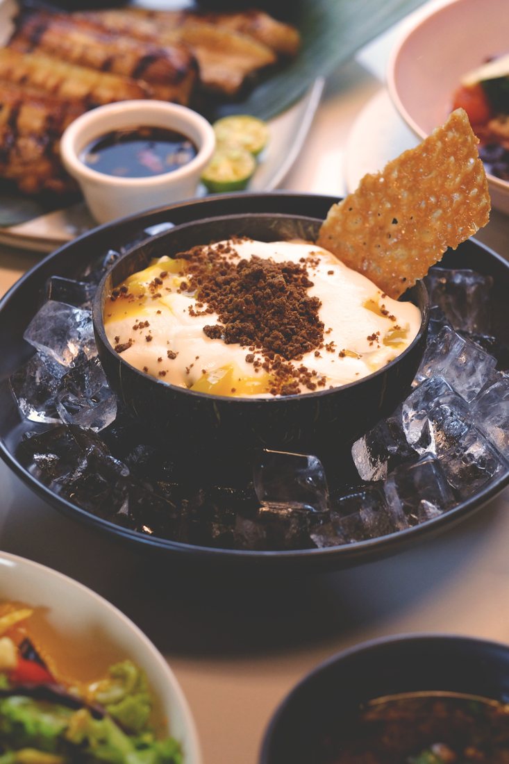 Mango Kilig, a dessert set on ice and topped with crumble and a cookie brittle wafer